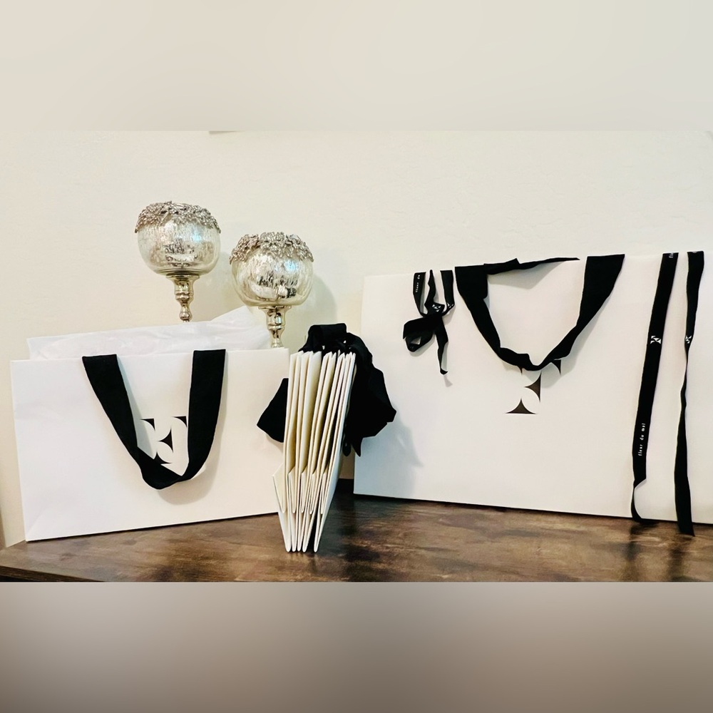 FLEUR DU MAL GIFT BAGS ,PACKAGING , BLACK RIBBON HANDLES.